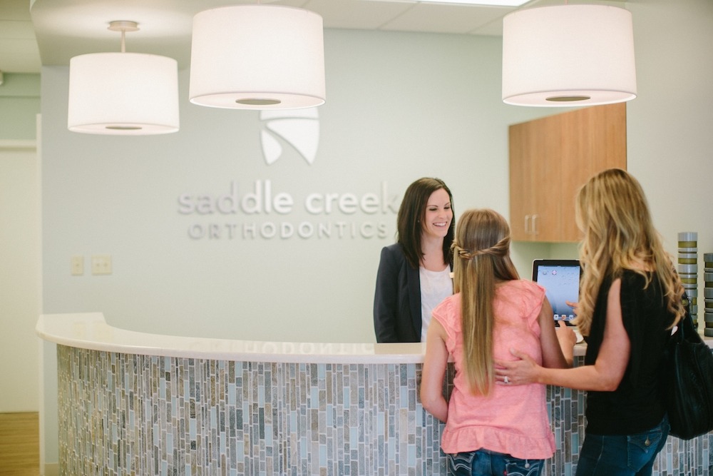 Welcome to Saddle Creek Orthodontics | Welcoming Orthodontic Patients | Front Desk Reception Orthodontic Office
