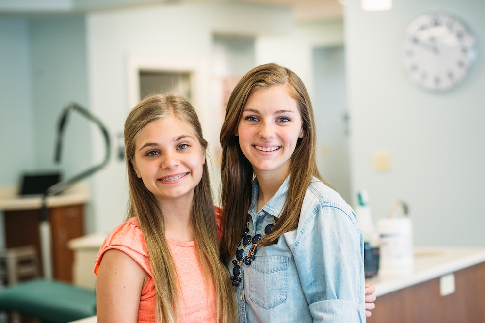 Saddle Creek Orthodontics | Patients with metal braces and ceramic braces | Kaitlin and Amelia